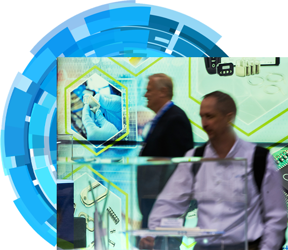 Two attendees examining products in the expo hall floor