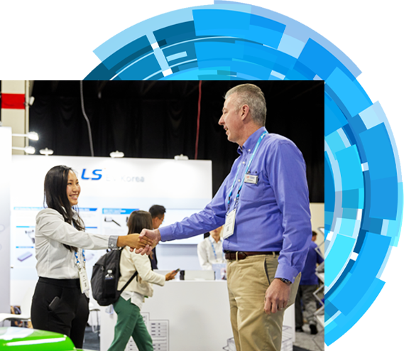 an Exhibitor is shaking hands with an attendee on the expo hall