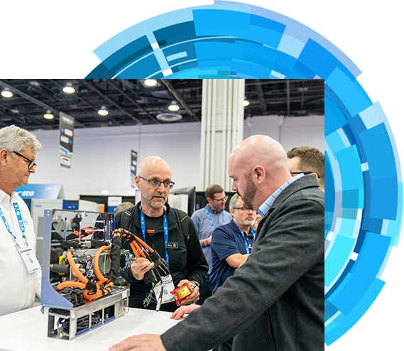 Four bussines men engaged in conversation at a bustling trade show event