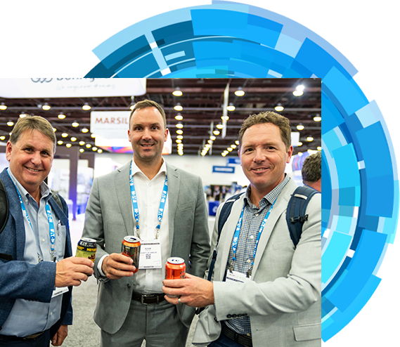  Three men dressed in suits are seen holding drinks at an event, capturing a moment of networking and conversation