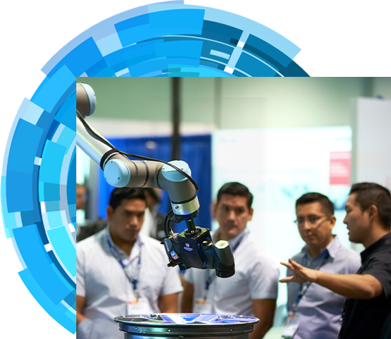 An exhibitor introducing a robot to three show attendees